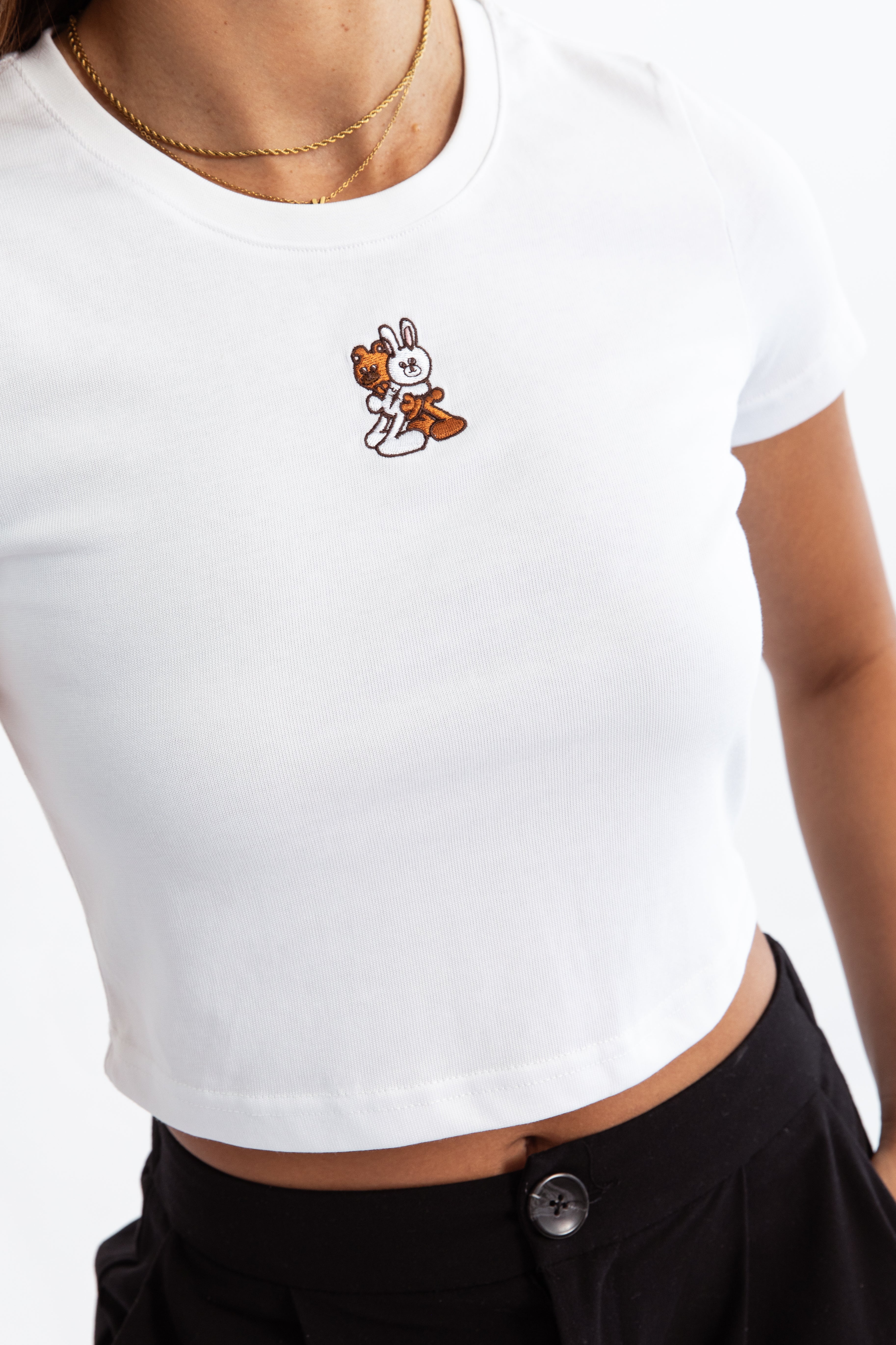 A white kohz crewneck bb crop t-shirt with embroidery on the chest.